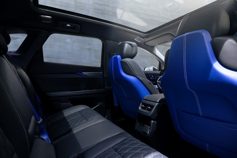 Back Seat View of the 2026 OPTIQ-V Blue Front Seats, Sun Roof, and Interior | Star Cadillac in Quakertown PA