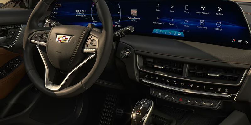 Cadillac vehicle interior featuring a digital dashboard and infotainment display